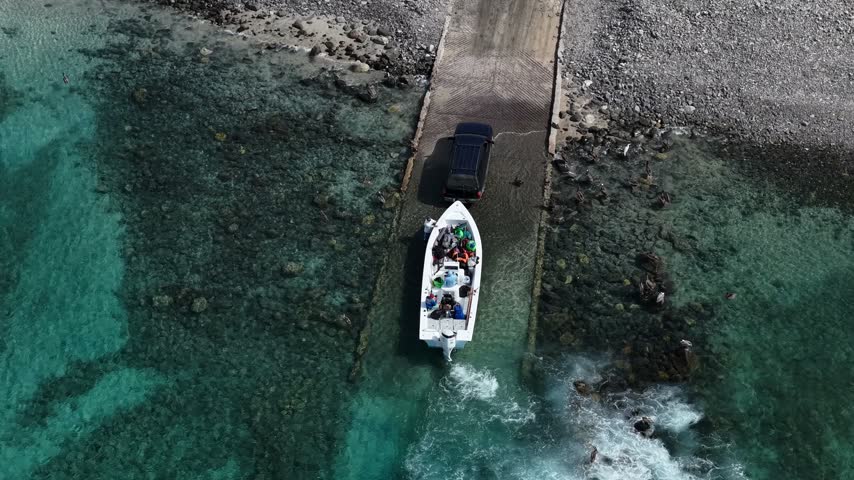 Aerial view of a boat being launched at a boat ramp in Ensenada de los Muertos, Baja California Sur.