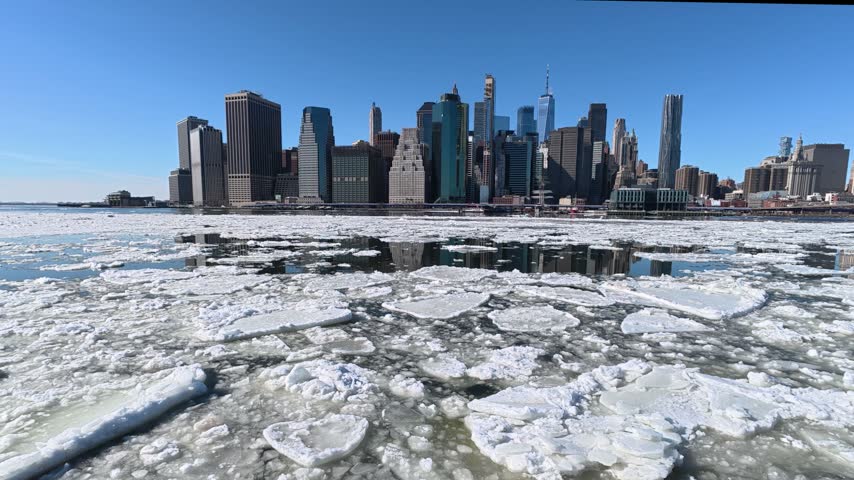 New York city skyline with frozen East river Brooklyn wide view