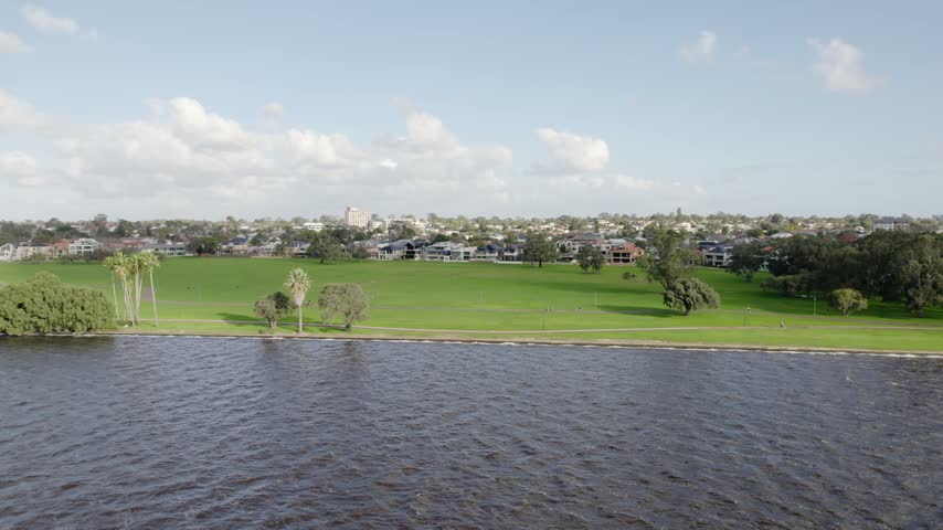 Green Parkland and Skyline View Across Swan River at Sir James Mitchell Park, South Perth, Australia