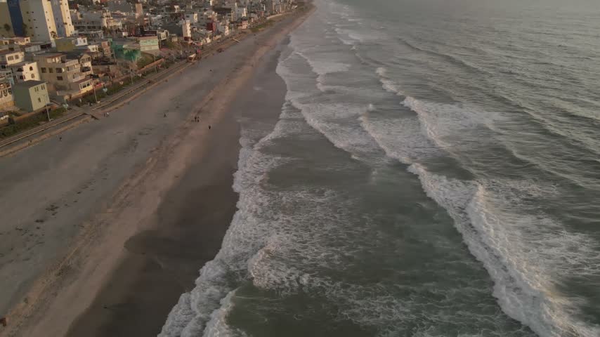Aerial drone view of Playas de Tijuana coastline and Pacific Ocean waves in Baja California Mexico