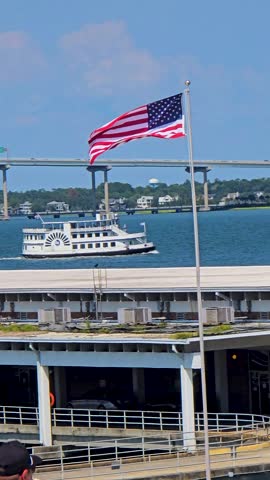 Footage of a boat sailing along the waterfront in Charleston South Carolina USA