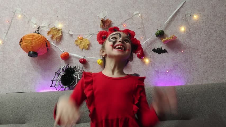 Kids trick or treat in Halloween costume. kids with a basket for sweets. A boy in a skeleton a girl in a witch costume. Children are having fun playing with balloons and laughing at holiday in autumn.