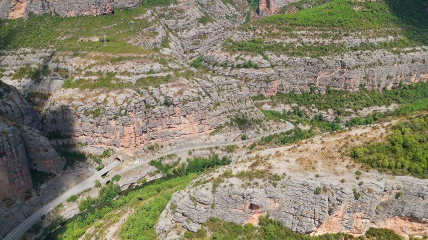 Aerial panorama of Congost de Collegats canyon with Noguera Pallaresa river and mountain road tunnels, Catalonia, Spain
