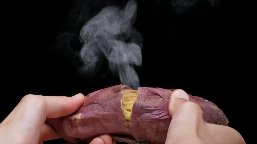 4K slow motion video of a baked potato slowly cracked open and steam coming out.
4K 120fps edited to 30fps