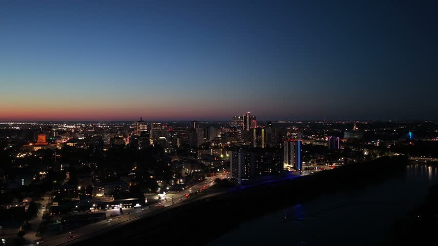Winnipeg, Manitoba skyline at night, cinematic drone shot