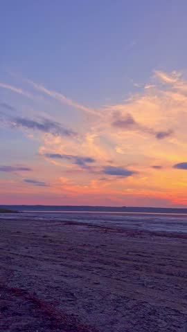 Vibrant Sunset Sky with Purple and Orange Clouds Over Salt Lake