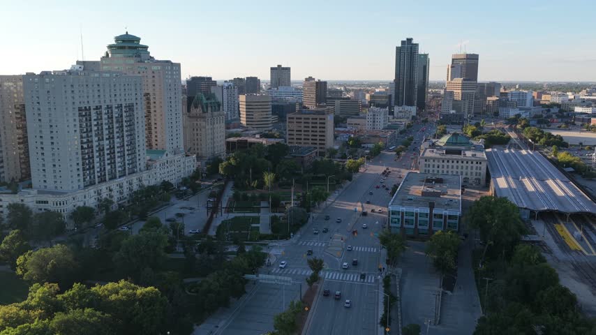 Winnipeg Main Street with Fort Garry Hotel, Portage and Main, Union Station, aerial skyline shot.