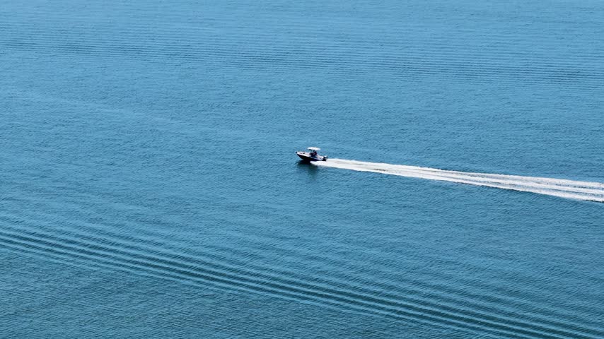 Footage of a boat sailing along the waterfront in Charleston South Carolina USA
