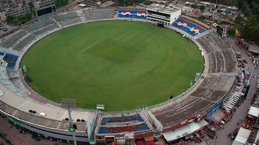 Rawalpindi, Pakistan - July 13, 2022. Aerial shot pulling back from a close view of Pindi Cricket Stadium