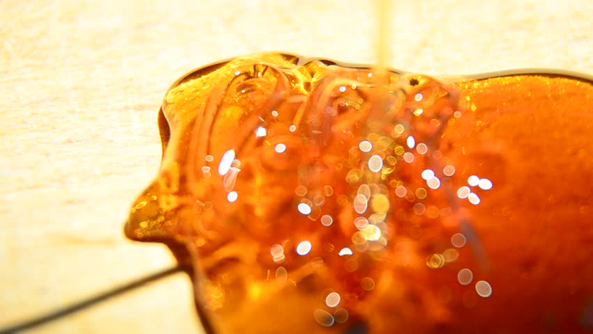 Honey pour closeup, Closeup of honey pouring