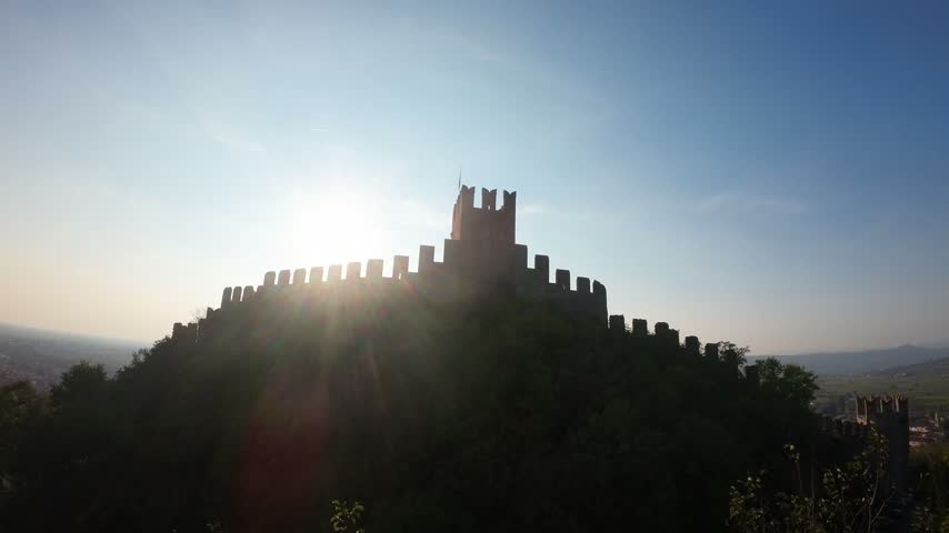 Ancient stone castle wall overlooking town
