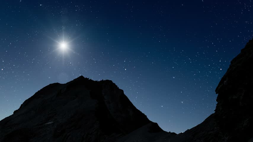 Glowing Christmas star above a peaceful mountain landscape