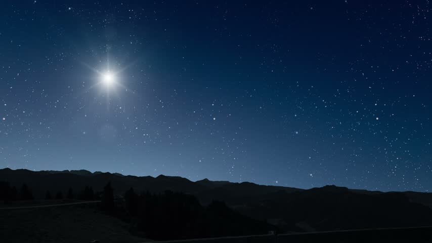 Glowing Christmas star above a peaceful mountain landscape