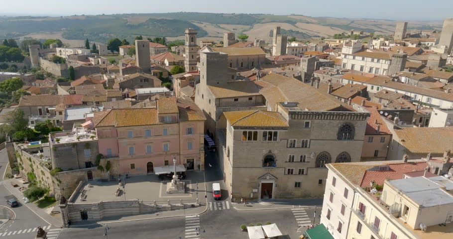 Aerial view of Palazzo Vitelleschi, a 15th century palace that houses the National Archaeological Museum, in Tarquinia, in the province of Viterbo, in Lazio, Italy, with the medieval towers behind.