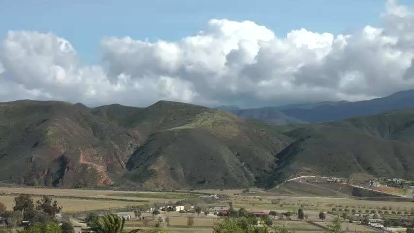 Clouds moving rapidly over hills