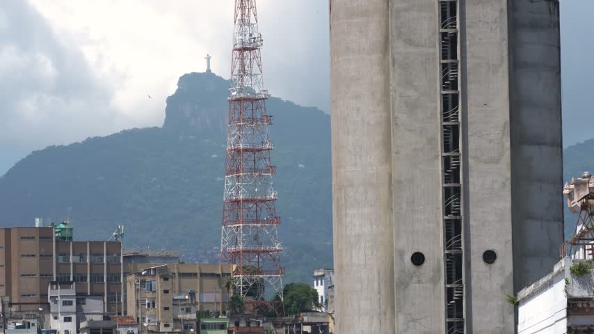 Rio de Janeiro, Brazil Moving View From Cruise Ship Christ the Redeemer Statue on Mountain. Telephoto Lens City Buildings, Radio Tower