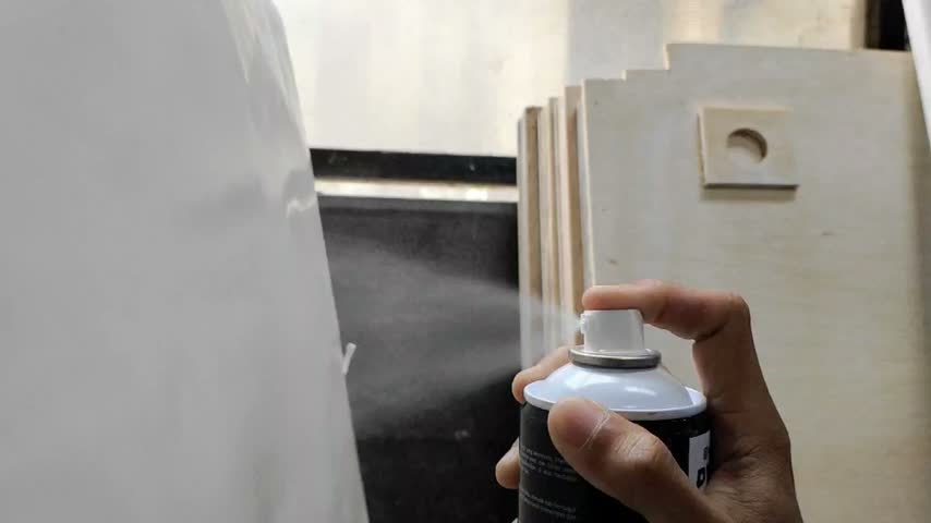 Hand Spray Painting Object with Aerosol Paint Can
​Close-up footage of a hand holding a spray paint aerosol can and applying paint on a surface in a workshop.
