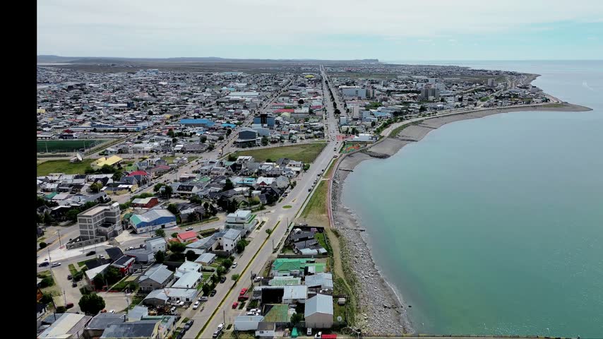 Panoramic high aerial view over the coastal city of Rio Grande, Tierra del Fuego, Argentina