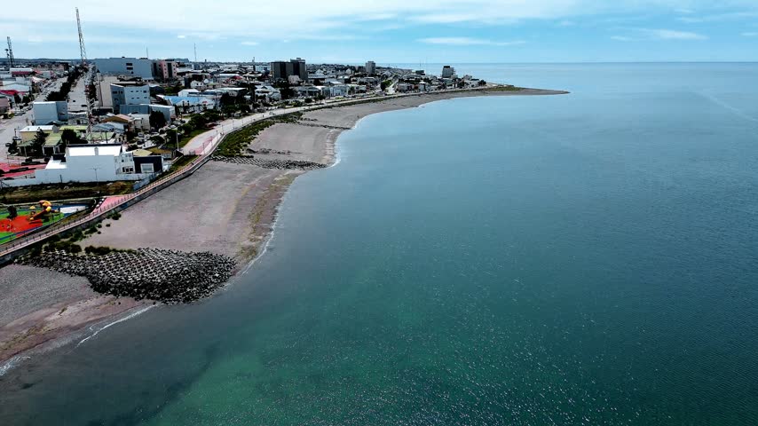 Panoramic high aerial view over the coastal city of Rio Grande, Tierra del Fuego, Argentina