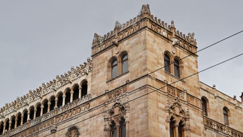 Eclectic ornate stone facade of the historic Palacio de Correos de Mexico in Mexico City displaying Plateresque Revival details