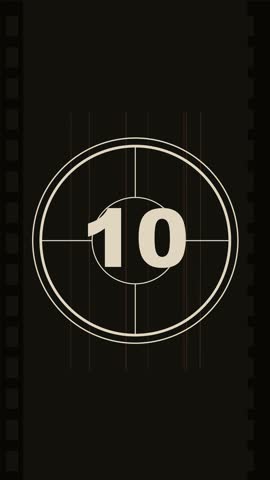 A vintage cinematic countdown sequence displays changing numerical digits inside a stylized oval frame against a dark background. This classic motion graphic features technical grid lines, circular elements, and mechanical framing, evoking a nostalgic atmosphere common in traditional broadcast production environments. The minimalist aesthetic utilizes monochromatic tones to emphasize the countdown progression.