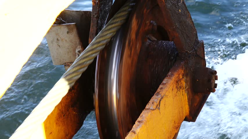 Stockholm, Sweden An industrial pulley and a metal cable over the Baltic Sea used to pull a small Stockholm archipelago ferry across a sound.  