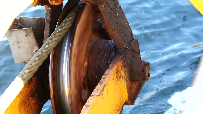 Stockholm, Sweden An industrial pulley and a metal cable over the Baltic Sea used to pull a small Stockholm archipelago ferry across a sound.  