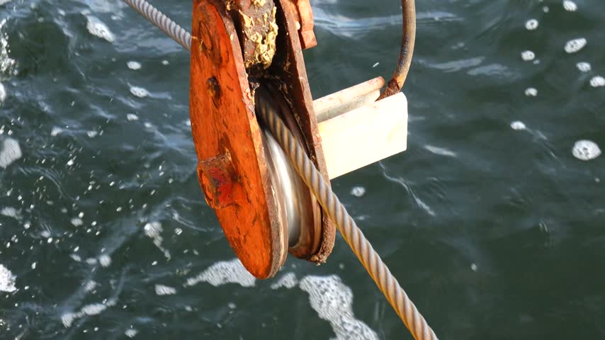 Stockholm, Sweden An industrial pulley and a metal cable over the Baltic Sea used to pull a small Stockholm archipelago ferry across a sound.  