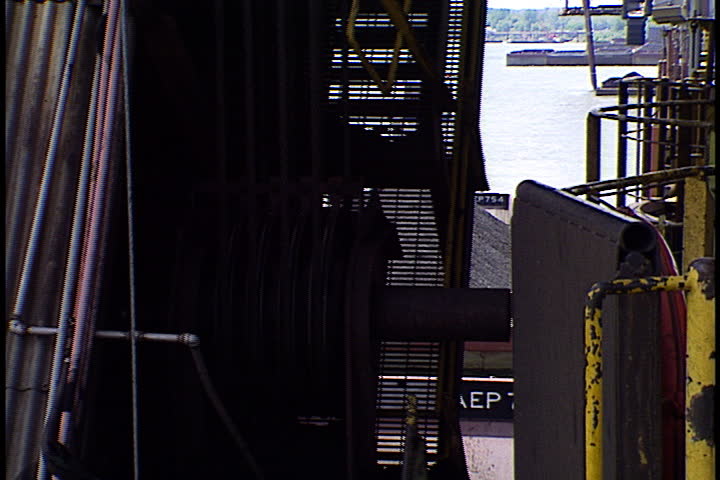 Offloading operation, coal is transported from barge by huge mechanical scooper in Metropolis, Illinois.