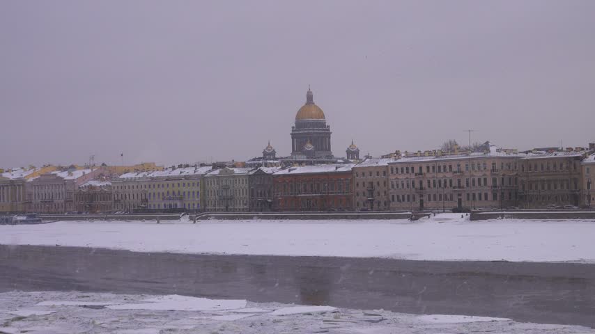 Winter landscape of frozen Neva River in capital of Russia St. Petersburg. Imperial residence of magnificent Russian Empire classical architecture. Admiralteiskaya embankment and Vasilyevsky Island