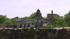 Video of old Spanish Mission San Juan Capistrano San Antonio, Texas. Front rock wall fence. Built in 1700's by missionaries and Indians. Front of chapel towers and bell. Don Despain of Rekindle Photo.
