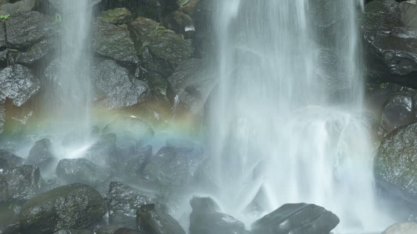 Cheonjeyeon Waterfall Crashes Over Rocky Terrain In Jungmun, Seogwipo On Jeju Island, South Korea. Close-up Shot