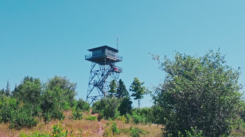 A nature look out tower over trails and trees for the use of park rangers on Isle Royale National Park.