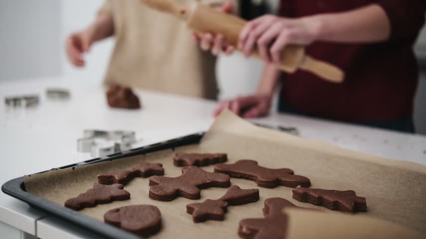 Sisters Bake Gingerbread Cookies For Christmas, Ready To Bake In The Oven