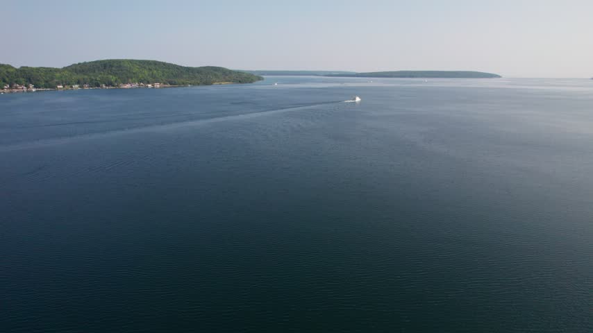 Ferry in Lake Superior Aerial of Munising Michigan in the Upper Peninsula during the morning hours on a bright summer day. 