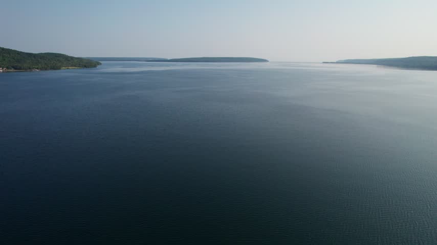 Rising Lake Superior Aerial of Munising Michigan in the Upper Peninsula during the morning hours on a bright summer day. 