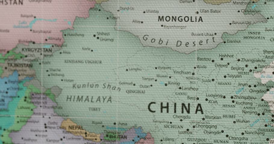 Detailed political map showing China, Mongolia, the Gobi Desert, and Japan with countries, cities, and borders marked on a textured canvas surface, highlighting the geography of East Asia