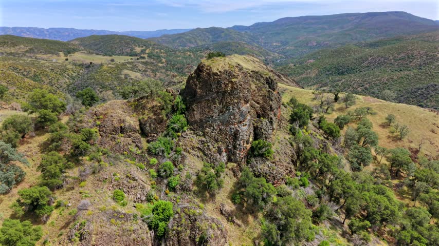Aerial view of the rocky terrain and oak-dotted hills of the Cedar Roughs Wildlife Area near Maxwell Creek in St. Helena, California, United States.