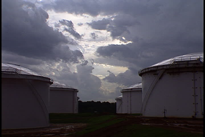 Oil storage tanks under low storm clouds in Atlanta, Georgia.