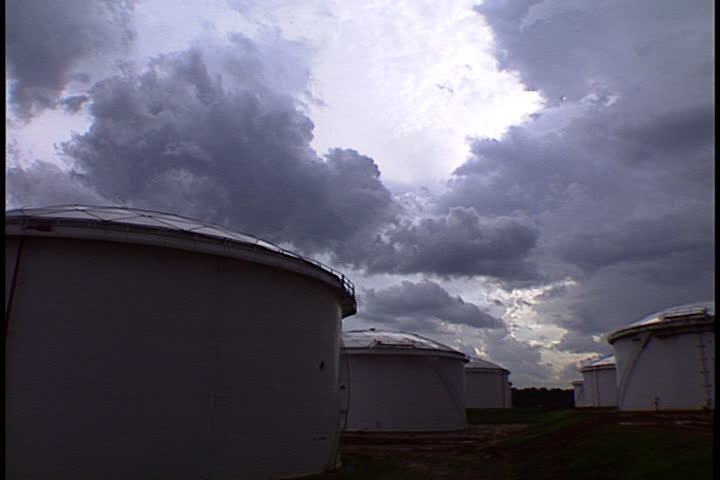Oil storage tanks under low storm clouds in Atlanta, Georgia.