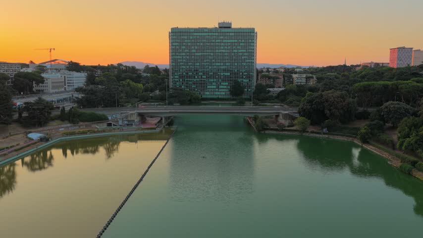 Aerial view of the modern architecture and lake in the EUR district at sunset in Rome, Lazio, Italy.