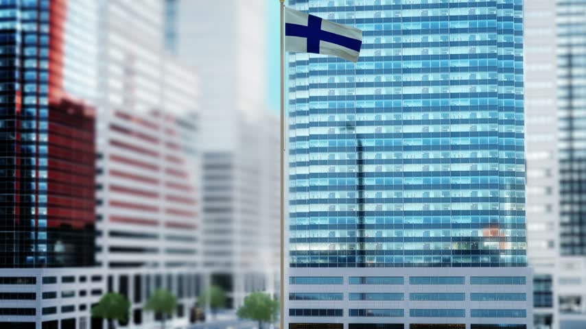 Finland Flag Waving by Modern Glass Buildings - Daytime
