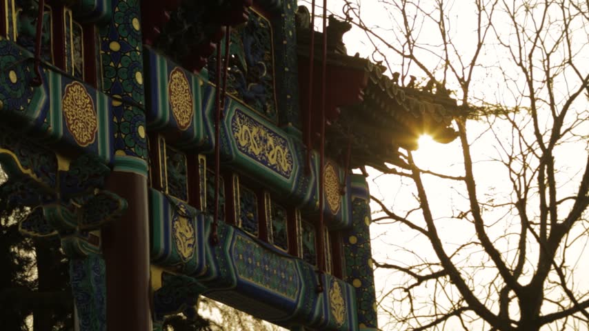 Sunlight Illuminates Ornate Temple Gate at Lama Temple in Beijing, China