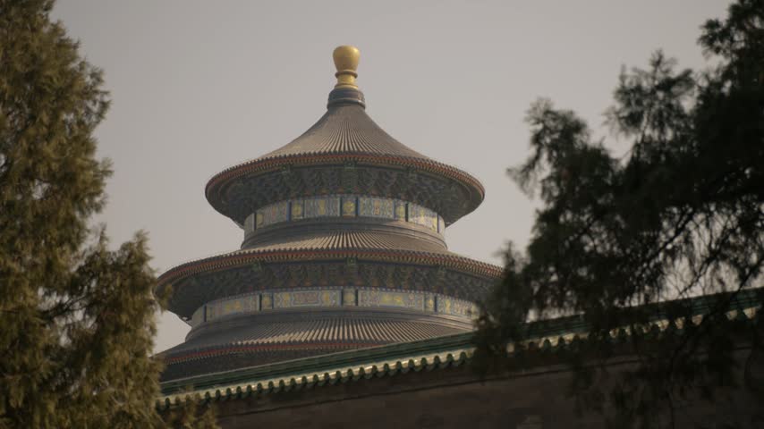 Traditional Temple Roof and Ornate Details Framed by Trees in Beijing, China