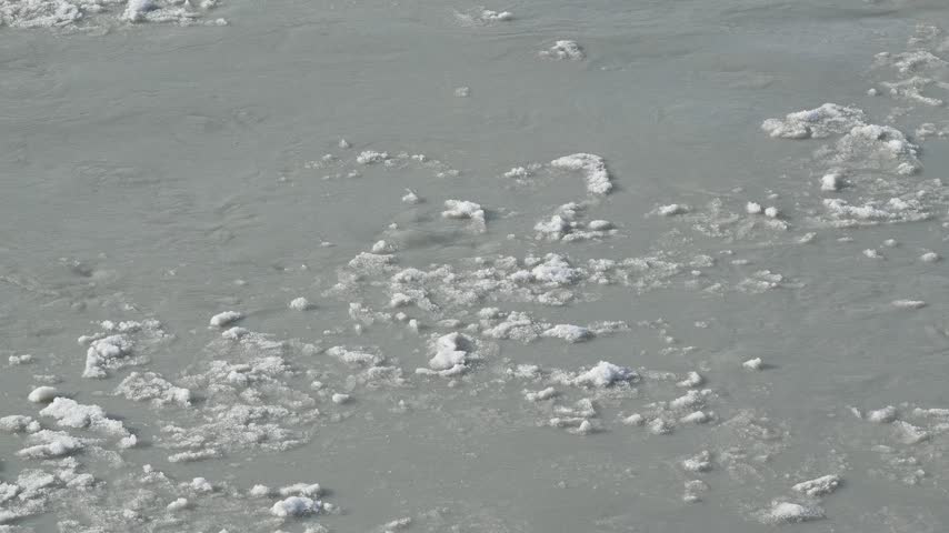 Ice Fragments Drifting in Glacial River near Kangerlussuaq, Greenland