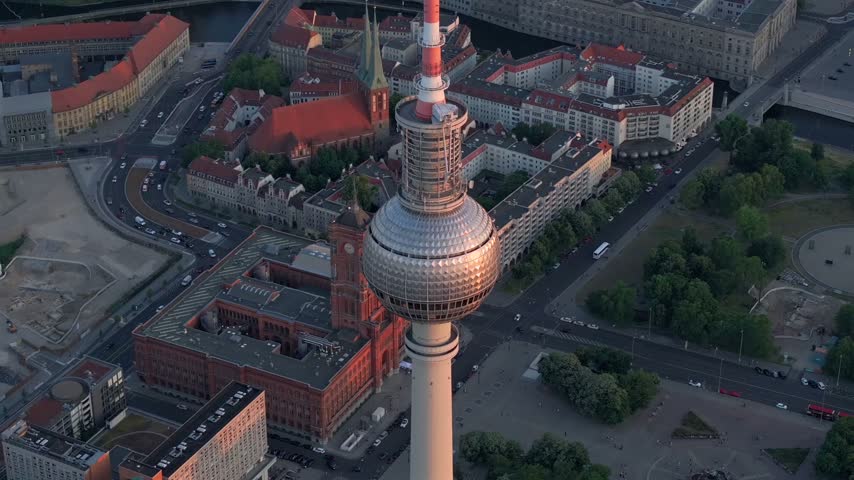 Berlin TV Tower Close up Aerial View with Amazing Soft Sunset Light. Alexanderplatz Fernsehturm in Berlin City Center.