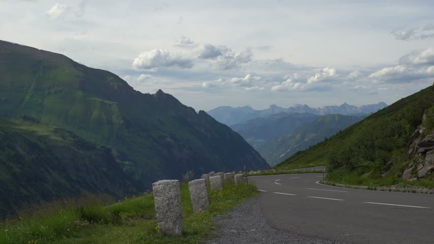 Car Driving Along the Scenic Grossglockner High Alpine Road in Austria