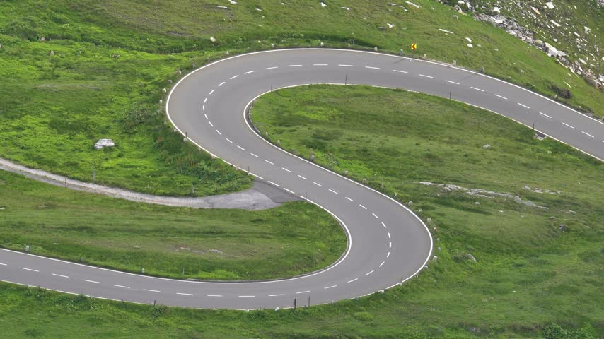 Car Driving Along the Scenic Grossglockner High Alpine Road in Austria