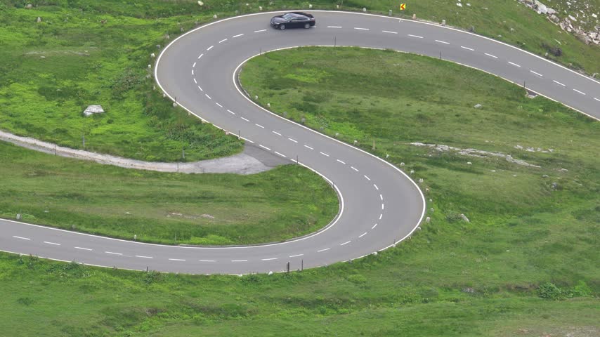 Car Driving Along the Scenic Grossglockner High Alpine Road in Austria