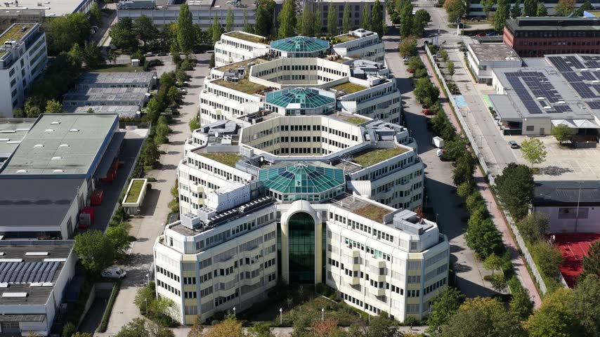Aerial View of Modern X-Shaped Sustainable Office Building in Munich Germany